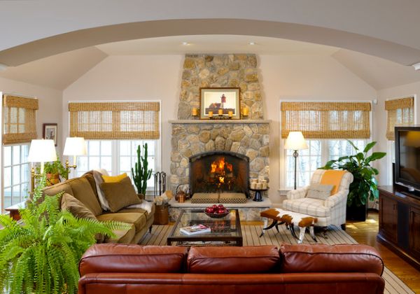 Stone fireplace and woven wood blinds create a classic and timeless look