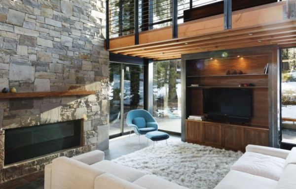Baby-blue Womb Chair in the corner blends beautifully with the plush rug