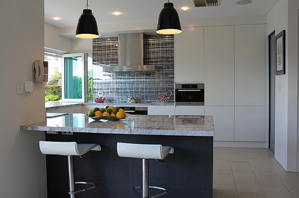 Beautiful kitchen and serving area with Caravaggio pendants above
