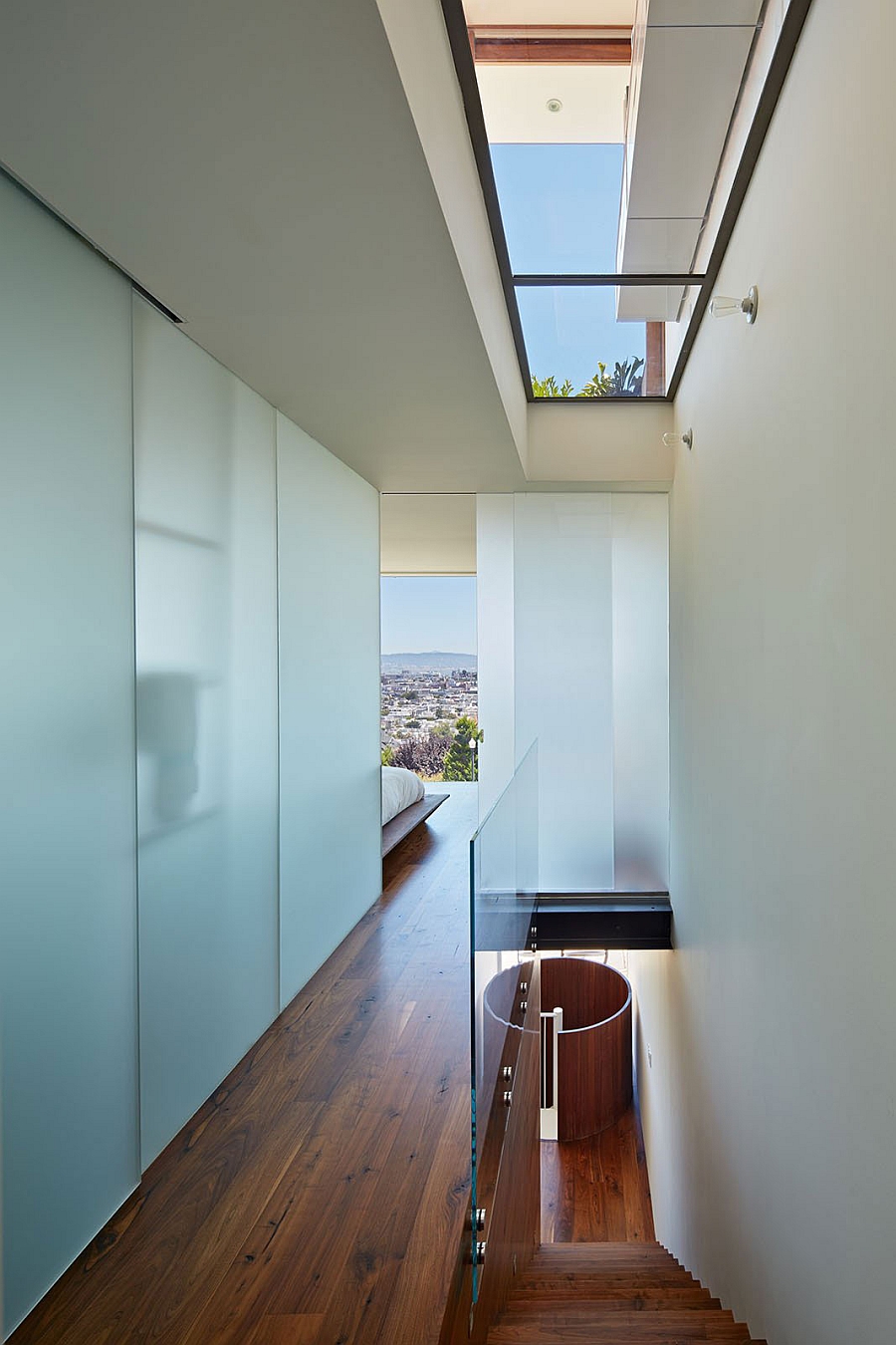 Sky lights usher in natural ventilation into the bedroom with San Francisco Skyline views