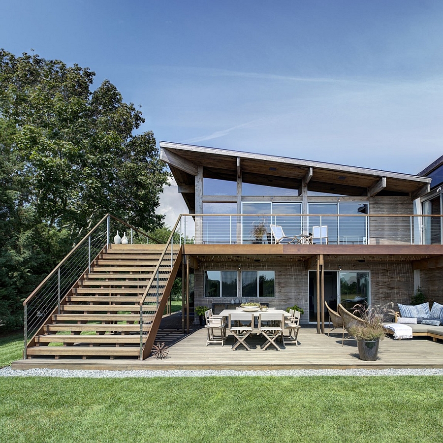 Smart renovation in glass and steel plays off of the framework of the existing house