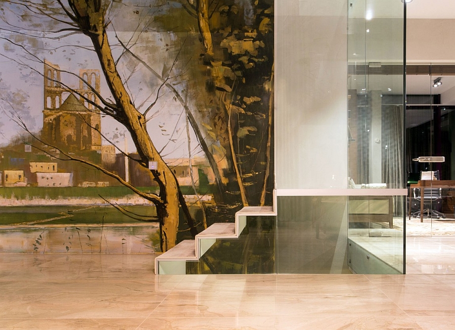 Large wall mural next to the stairs adds color to the interior