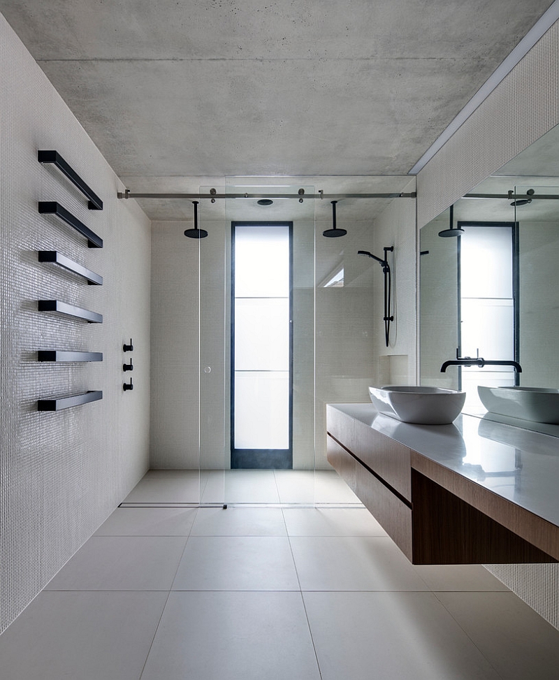 Floating wooden vanity in the bathroom lends visual airiness to the space