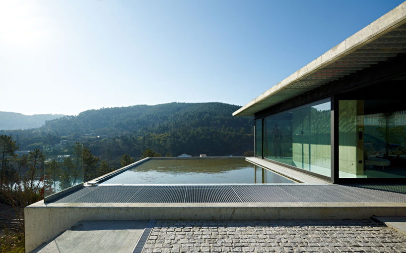 Outdoor courtyard with pool and river views