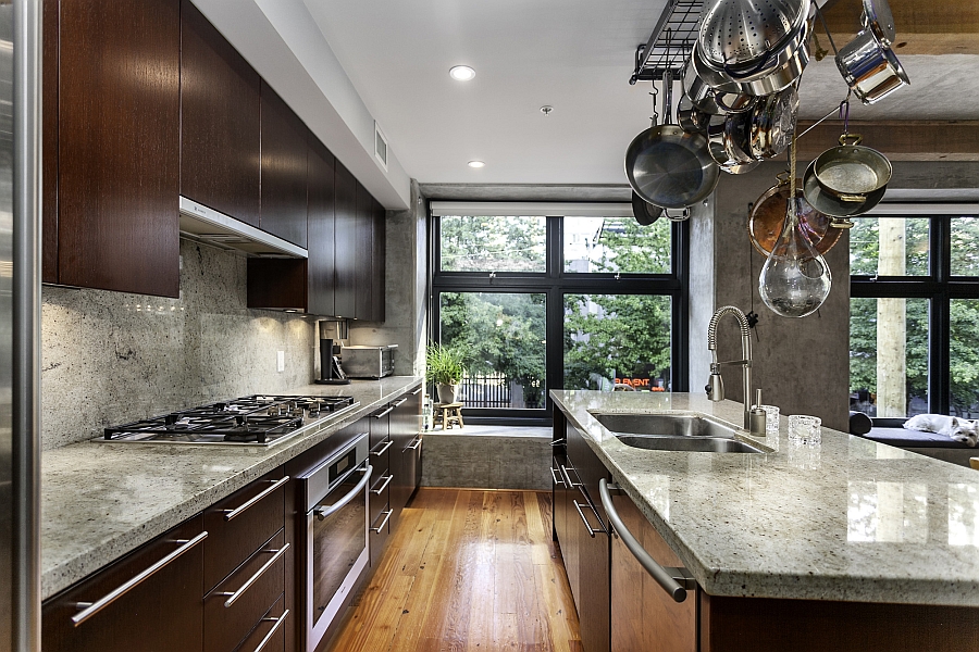 Traditional kitchen design with apot rack above the island
