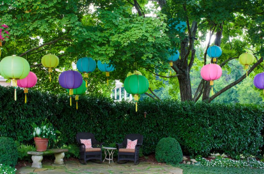 A festive backyard with hanging lanterns