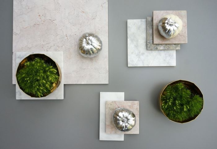 Marble tiles and spray painted pumpkins on a fall table