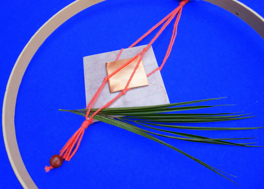 A wooden embroidery hoop anchors this wall hanging project