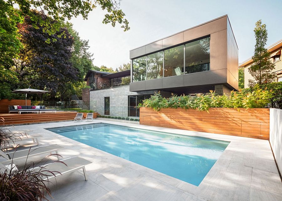 Anthracite-colored concrete extension of the lovely Montreal residence