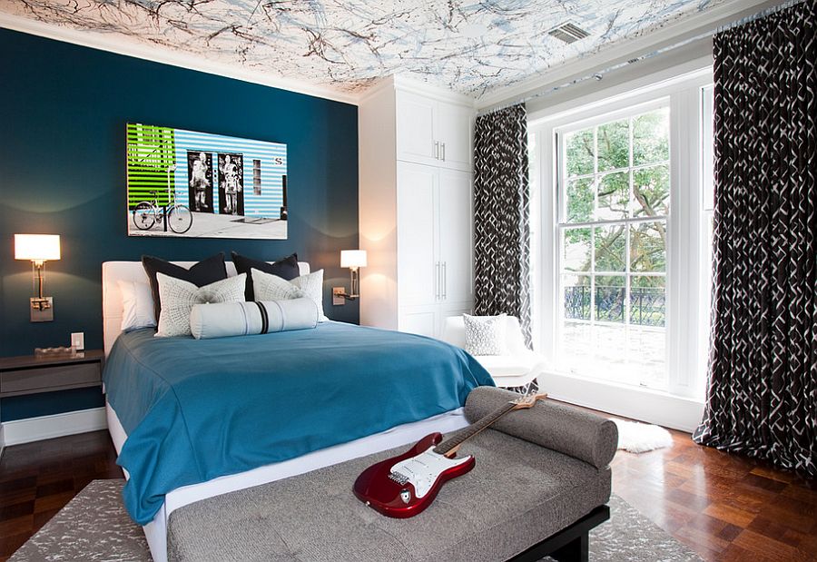 Posh boys’ bedroom with a beautiful blue accent wall and creative ceiling