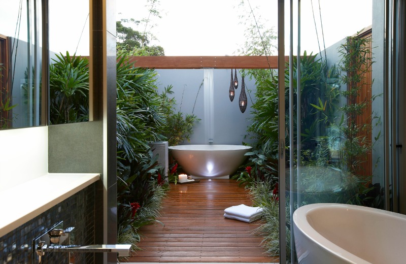 Yes, this bathroom has two tubs—one inside and one out!