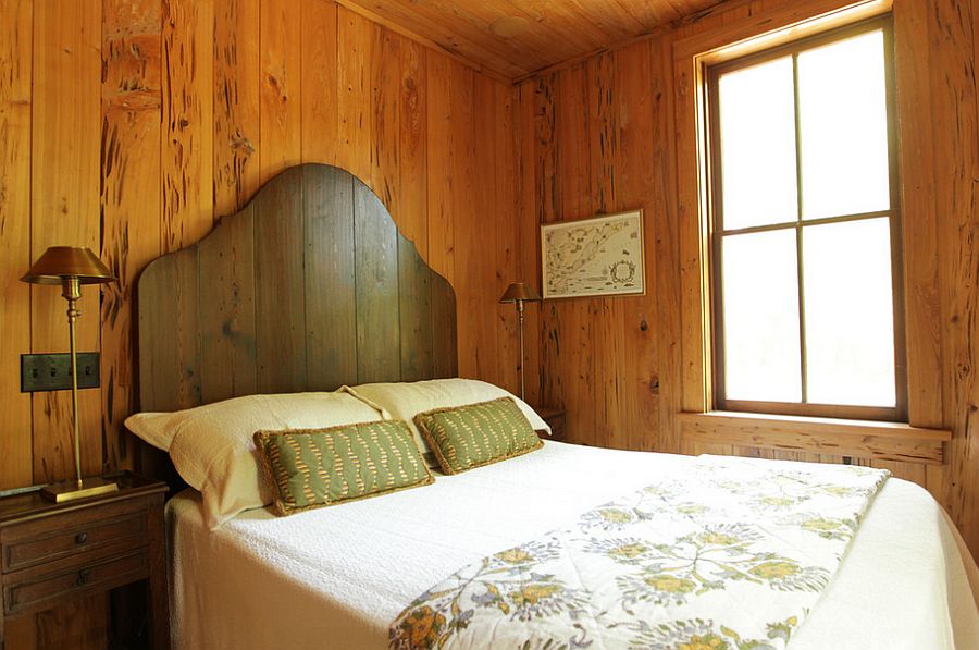 Simple wooden headboard adds to the beauty of the rustic, elegant bedroom