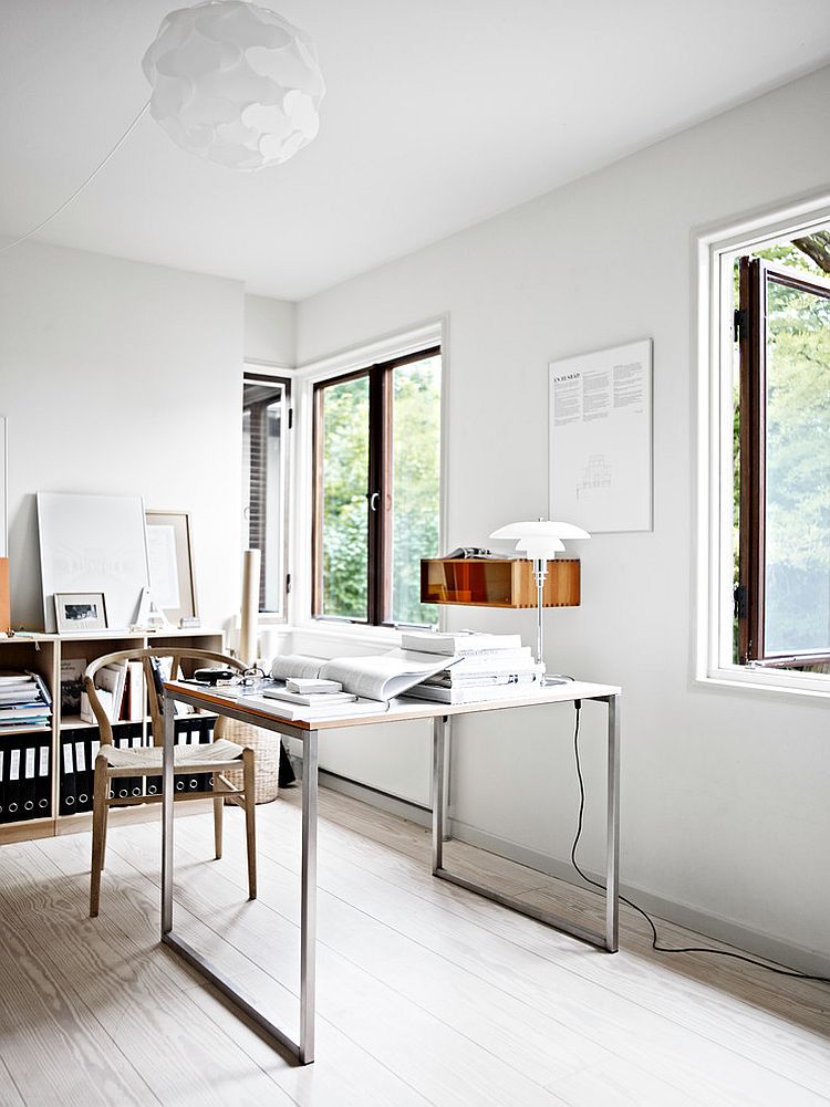 Wishbone chair and sleek desk give the home office an airy ambiance