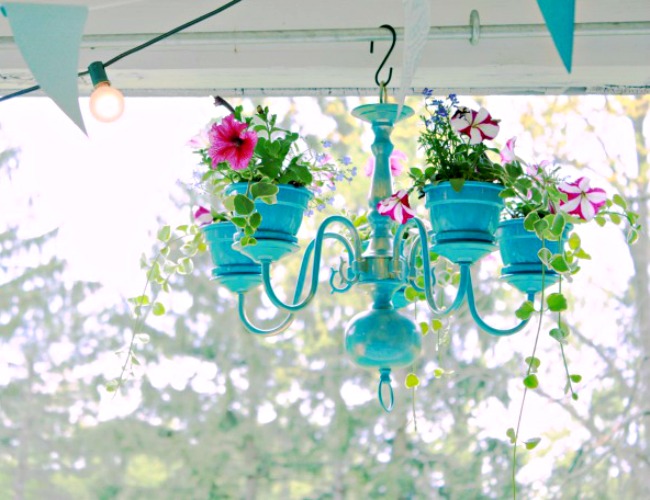 This chandelier was repainted the same color as the pots that were attached to it