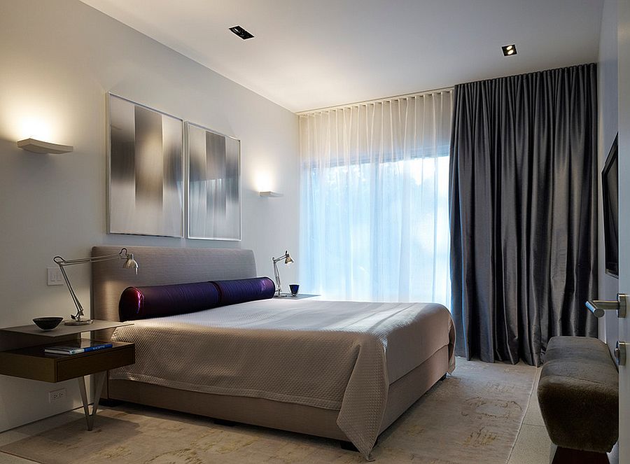 Combine light sheer curtains with blackout drapes in the bedroom