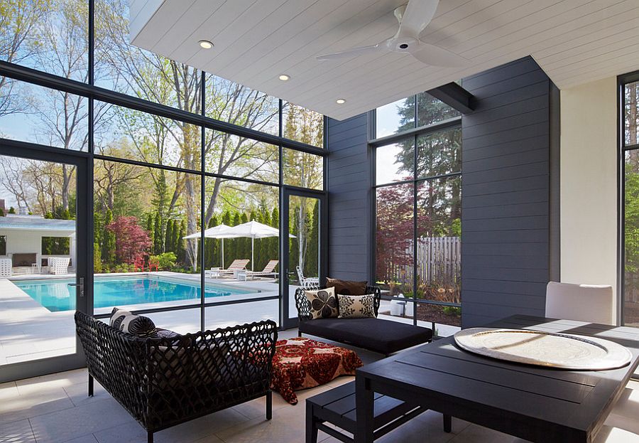 Dark furniture for the sunroom next to the pool