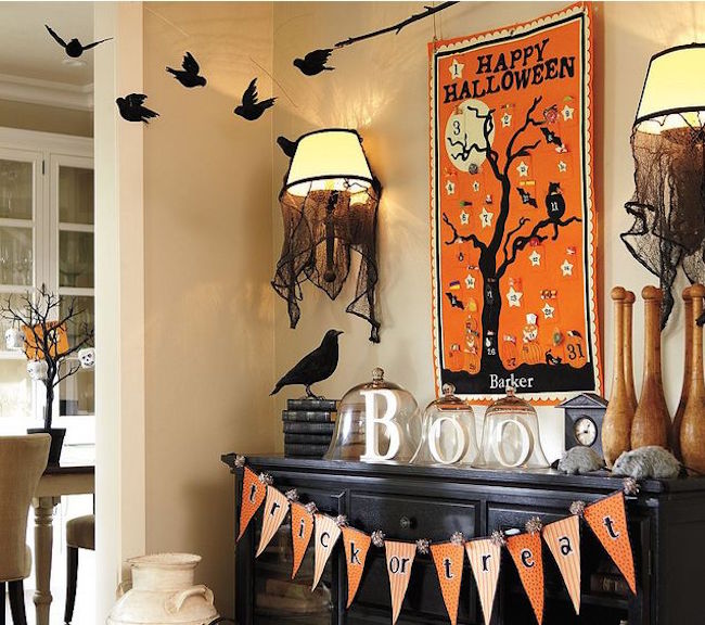 Black fireplace with elaborate Halloween decor that extends above it