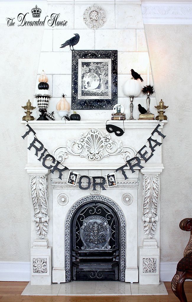 Classy Halloween decor that doesn't cover up this fireplace's beautiful details