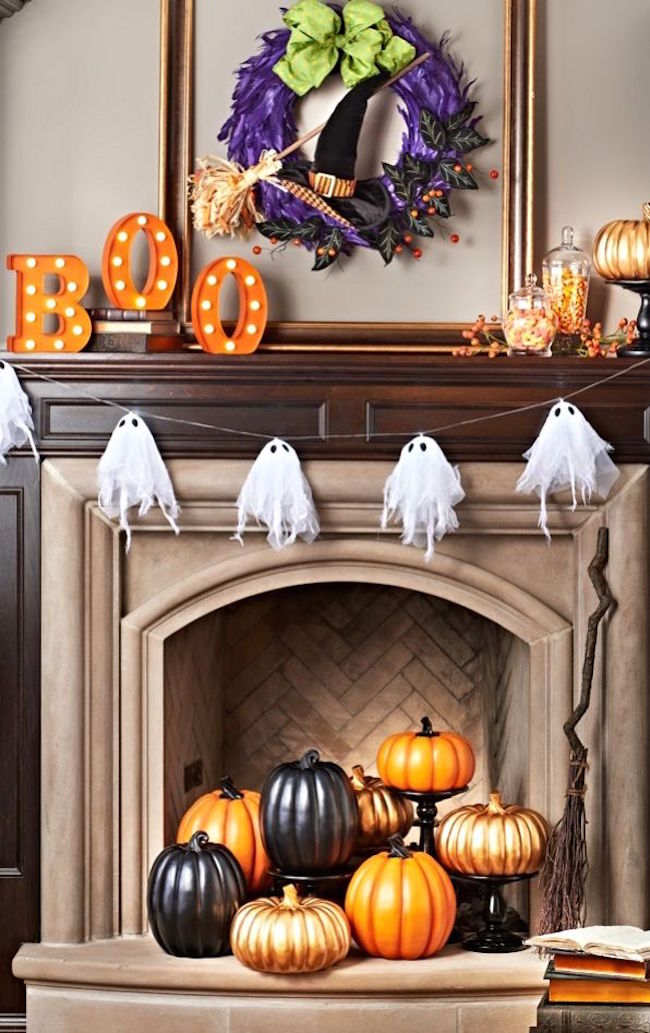 Colorful fireplace with bright orange and black pumpkins