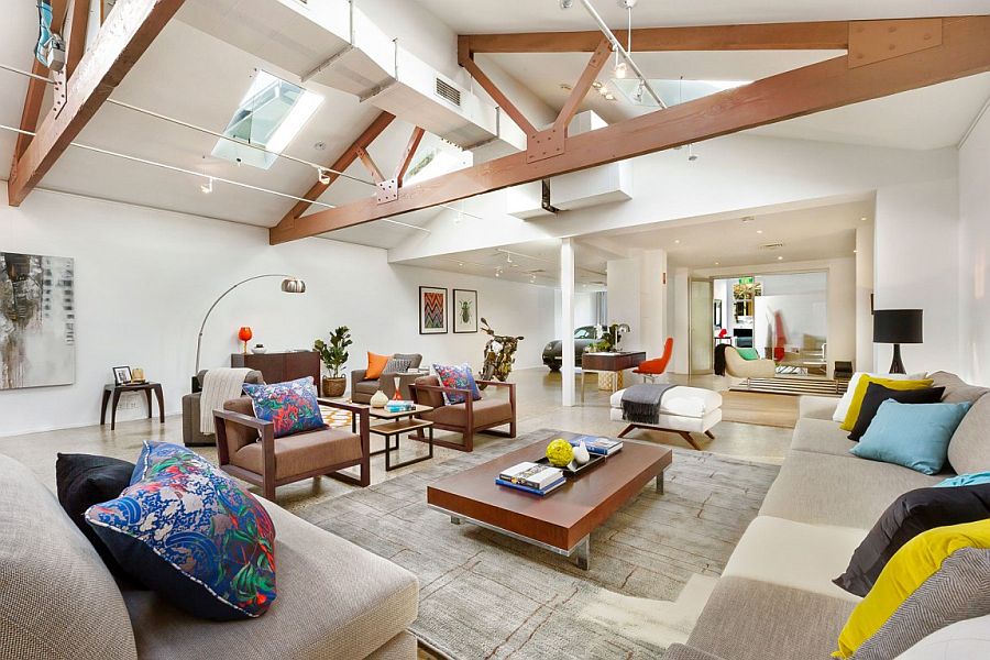 Accent pillows and wall art bring color and excitement to the contemporary warehouse conversion