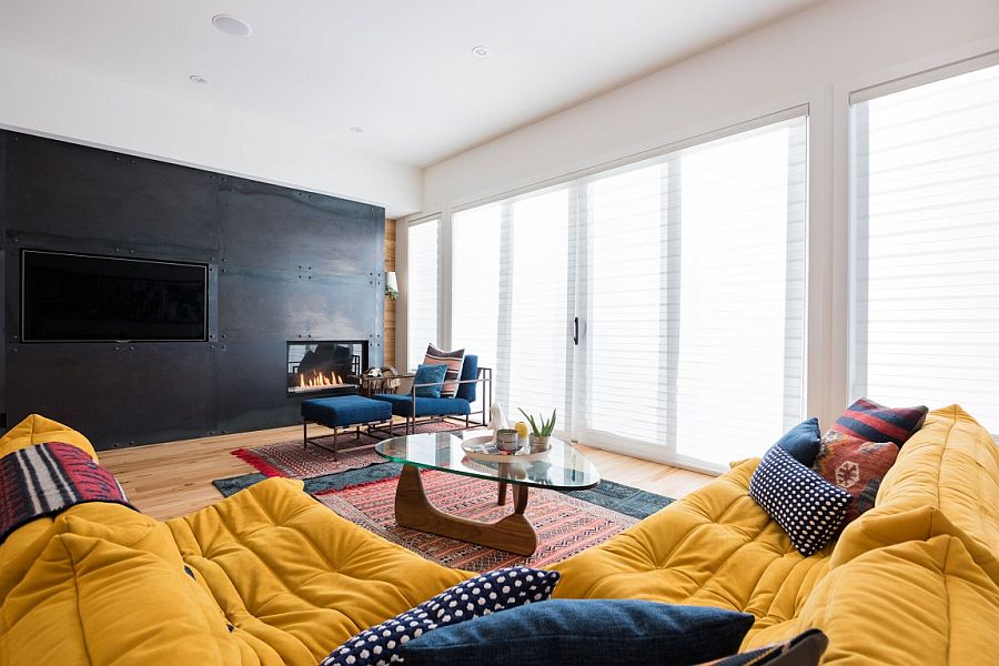 Dark accent wall in the living space with TV and fireplace