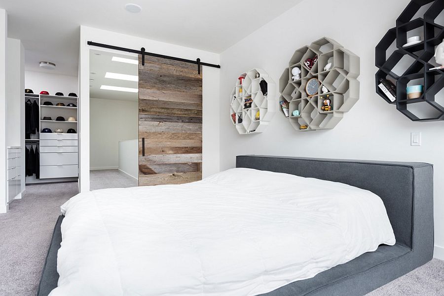 Modern minimal master bedroom with sliding barn door