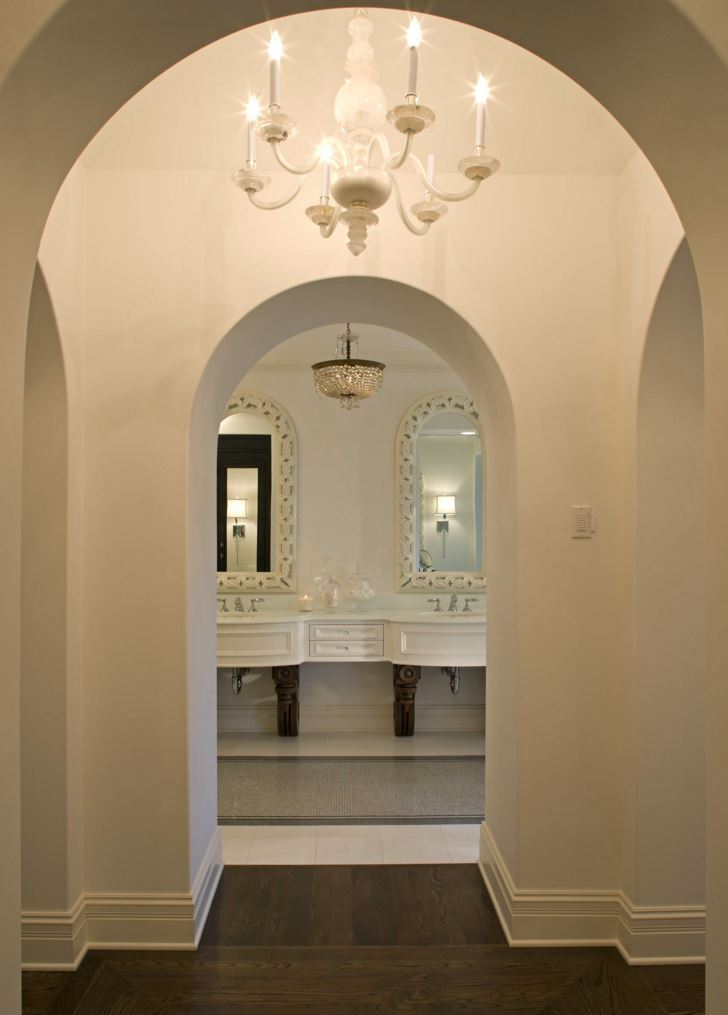Hallway view to an elegant eclectic bathroom
