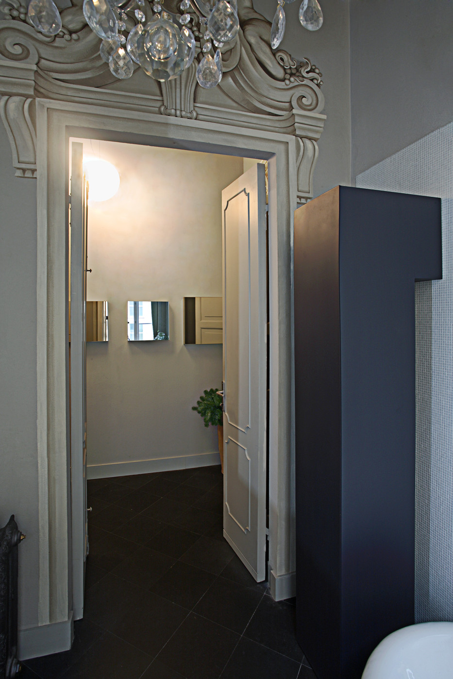 Ornate doorway with a mirrored view