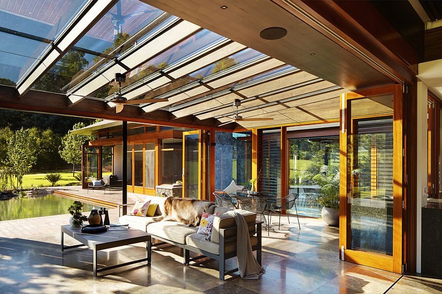 Asian sunroom with glass roof and retractable external shade blinds