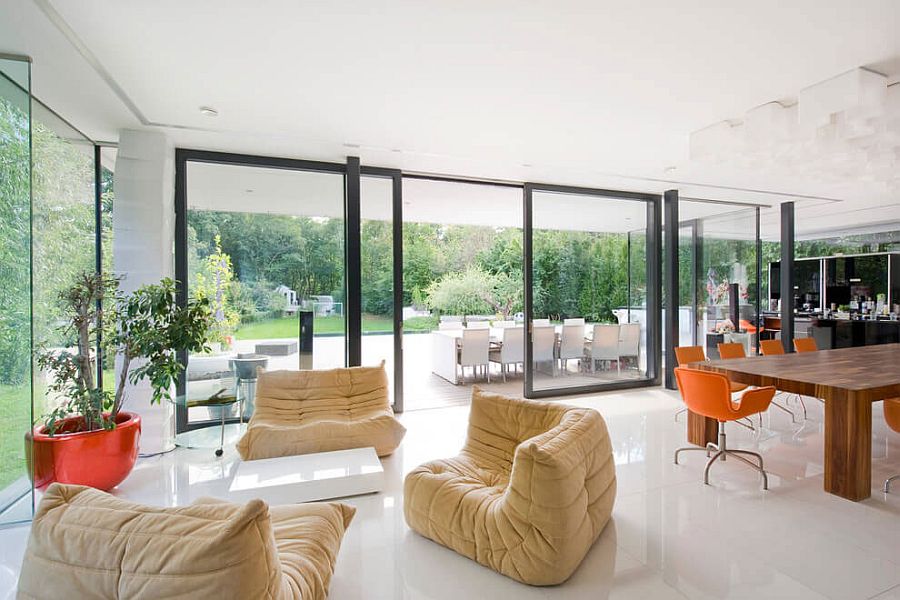 Indoor plant in large, striking red pot is a reat addition to the interior