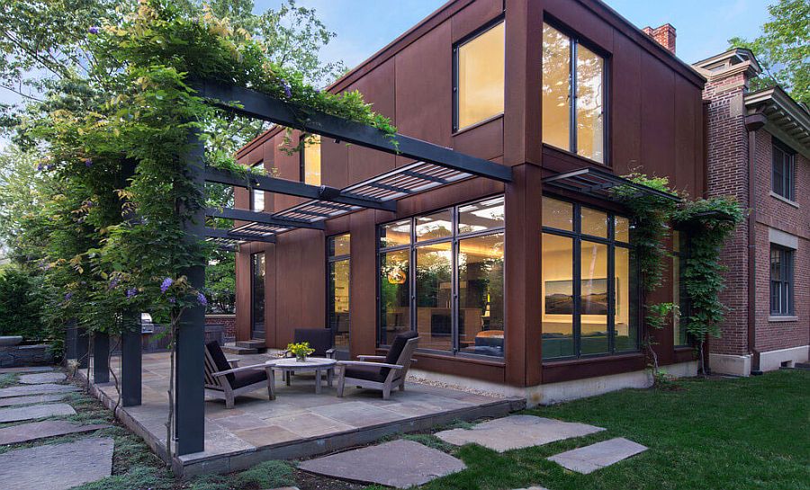 Modern cor-ten steel and glass extension for classic Fayerweather Street Residence