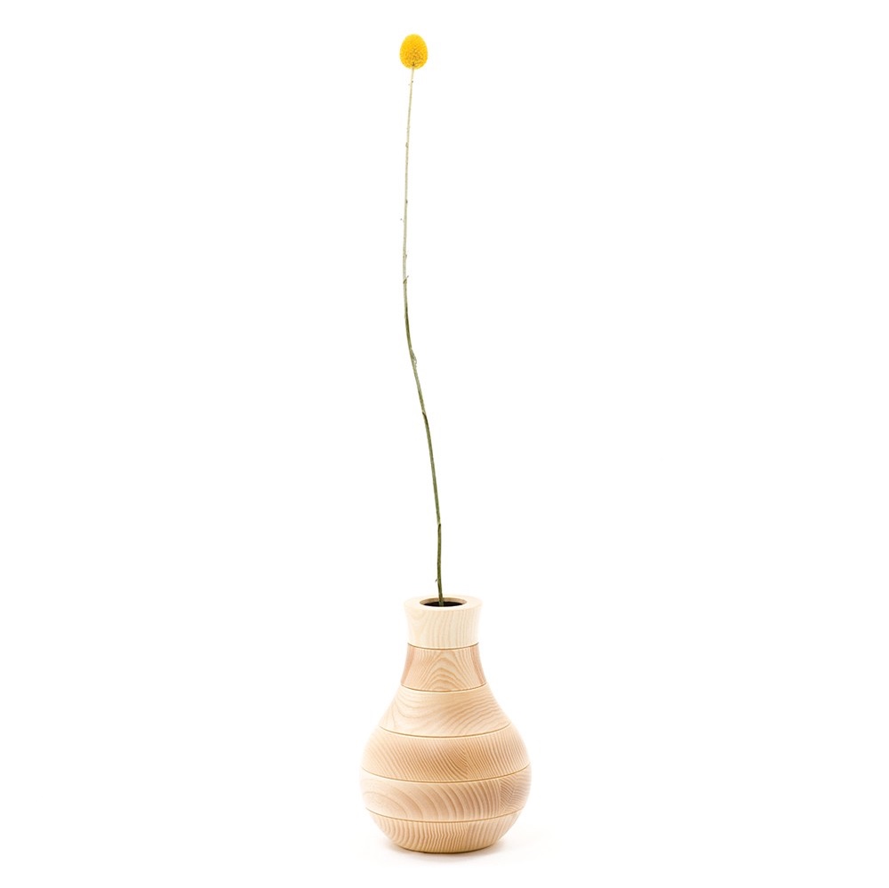 The Toy Vase, designed by Ding 3000, is made up of modular ash wood rings covering an aluminium inner tube. Shown here in natural ash. Image © 2016 Discipline.