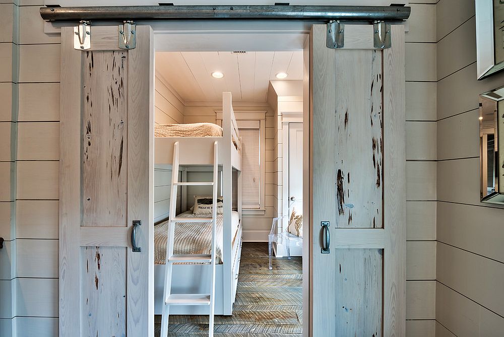 Beach style kids’ room with small sliding barn doors