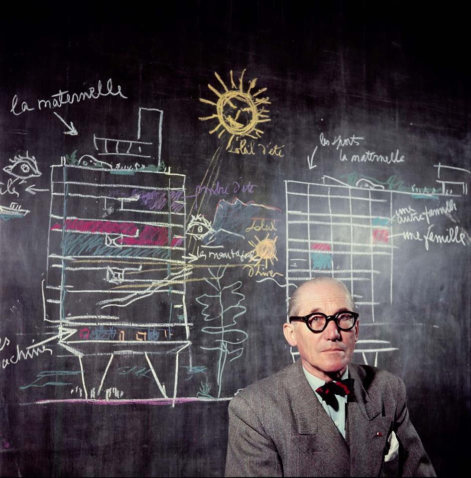 Le Corbusier in front of a section drawing of his Unité d'Habitation. Photographed in 1953 by Willy Rizzo. Image via Fast Company.