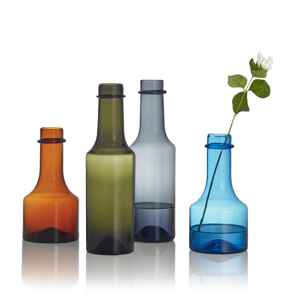 Wirkkala glass bottles. Designed by Tapio Wirkkala and originally produced by Iittala between 1959 and 1968. Image © Fiskars Finland.