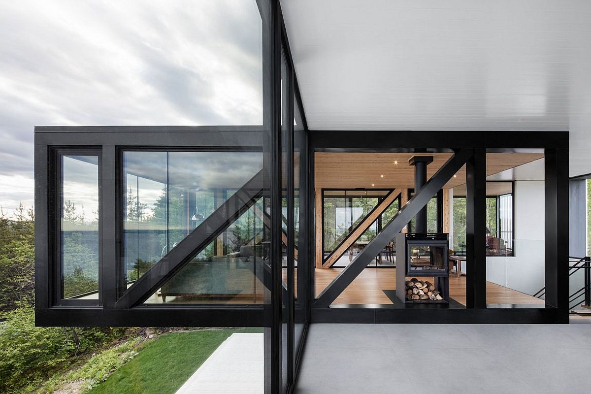 Dark framed glass walls give the elegant chalet its unique modern vibe
