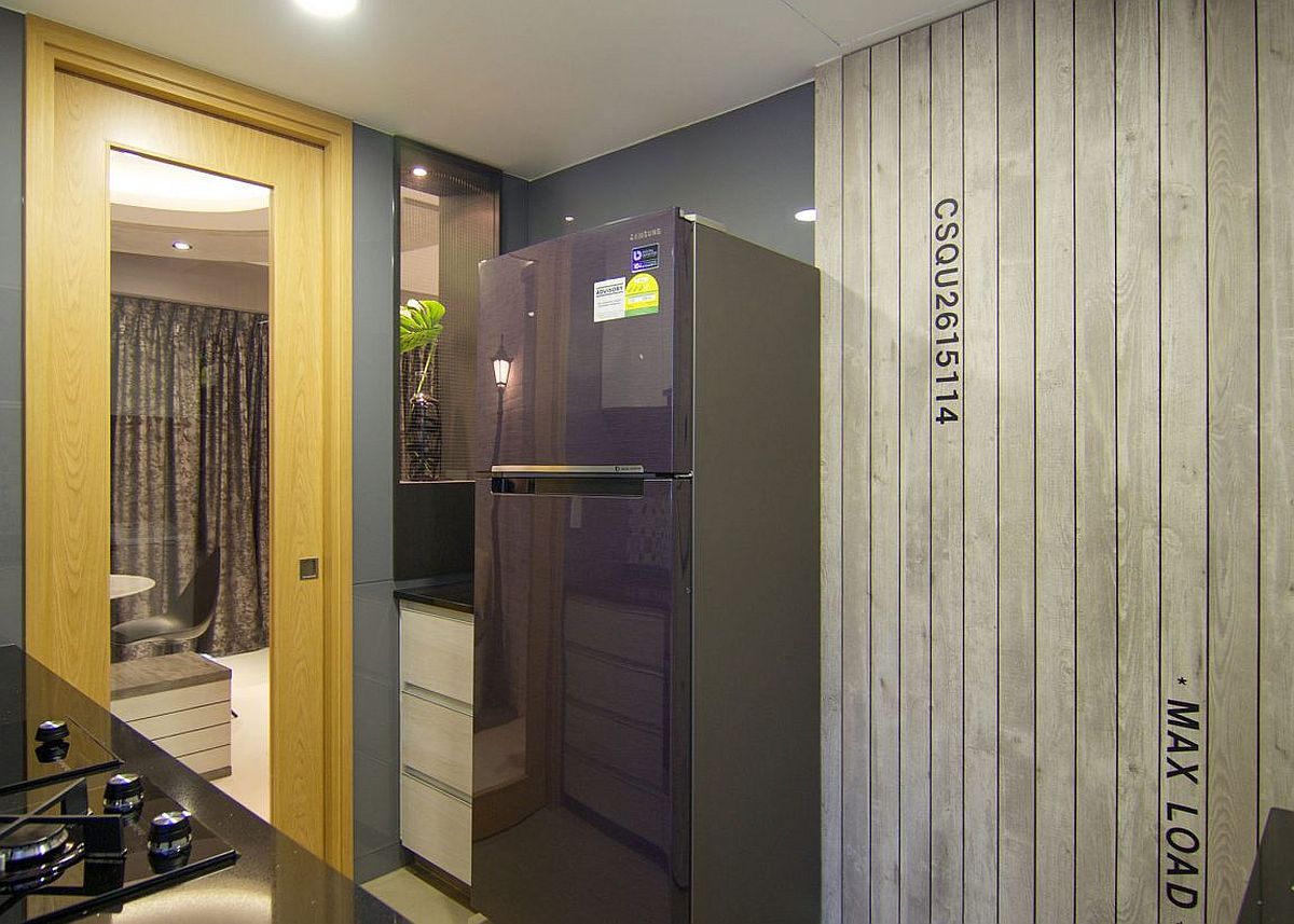 Weathered timber adds another unique finish to the interior of the bright home in Singapore