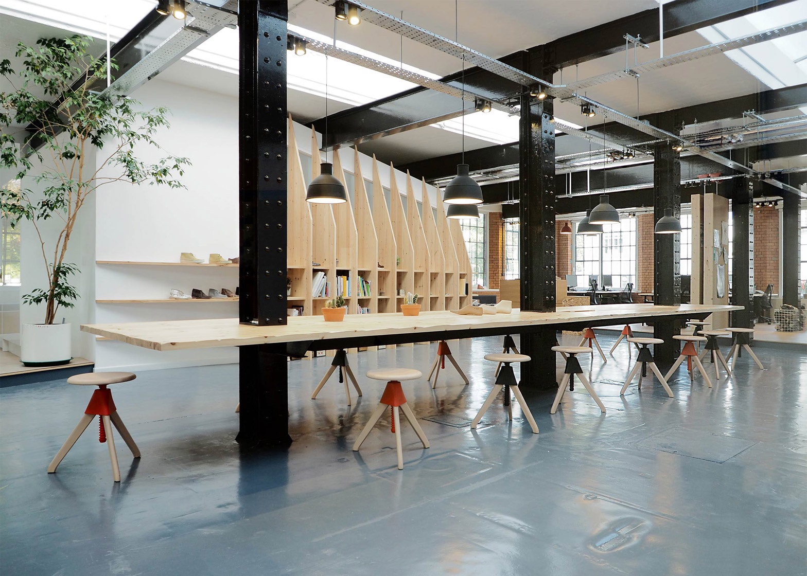 Paris-based ARRO Studio transformed a 19th-century warehouse into a modish design studio for trusted British shoe brand Clarks. Image via Dezeen.