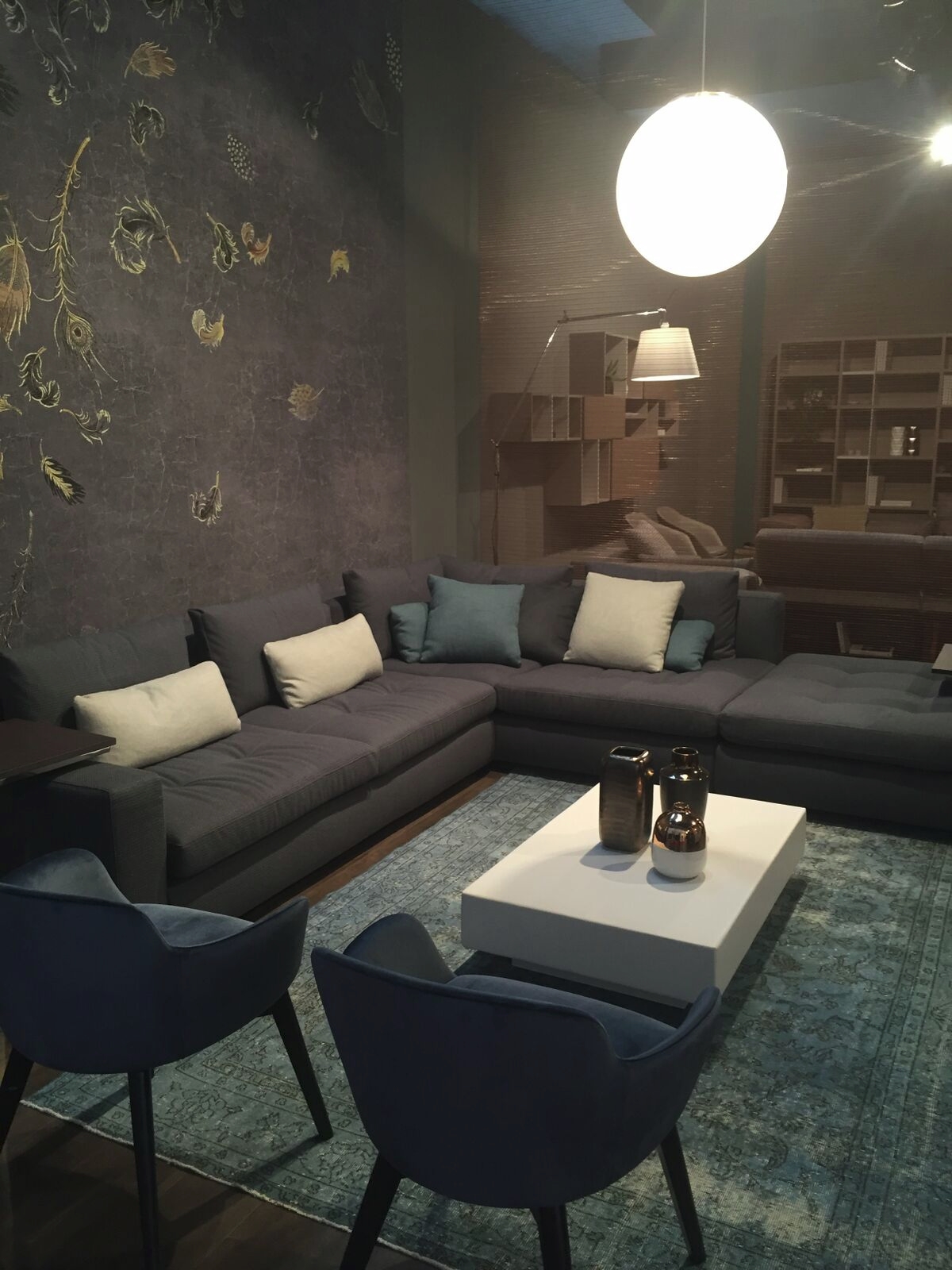 Grey sofa with smoky blue pillows