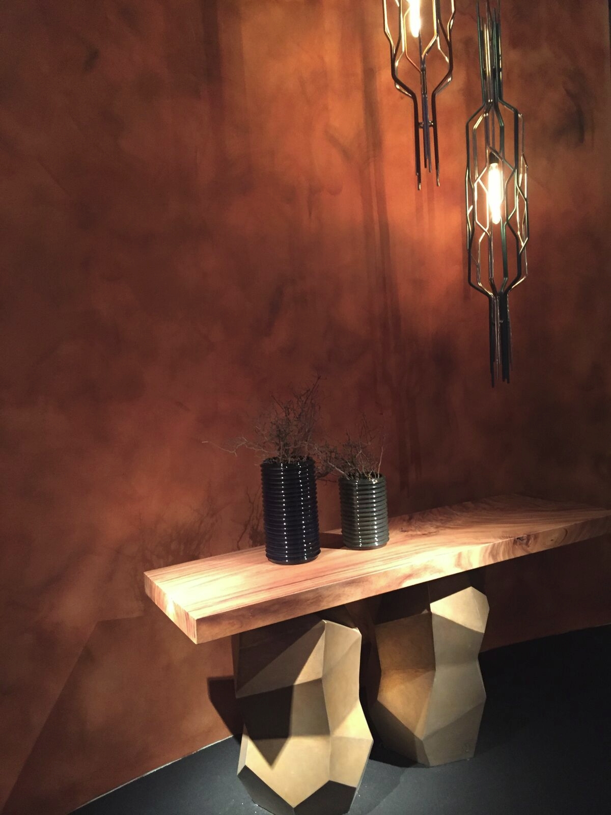 Wooden furnishings against a warm-toned wall