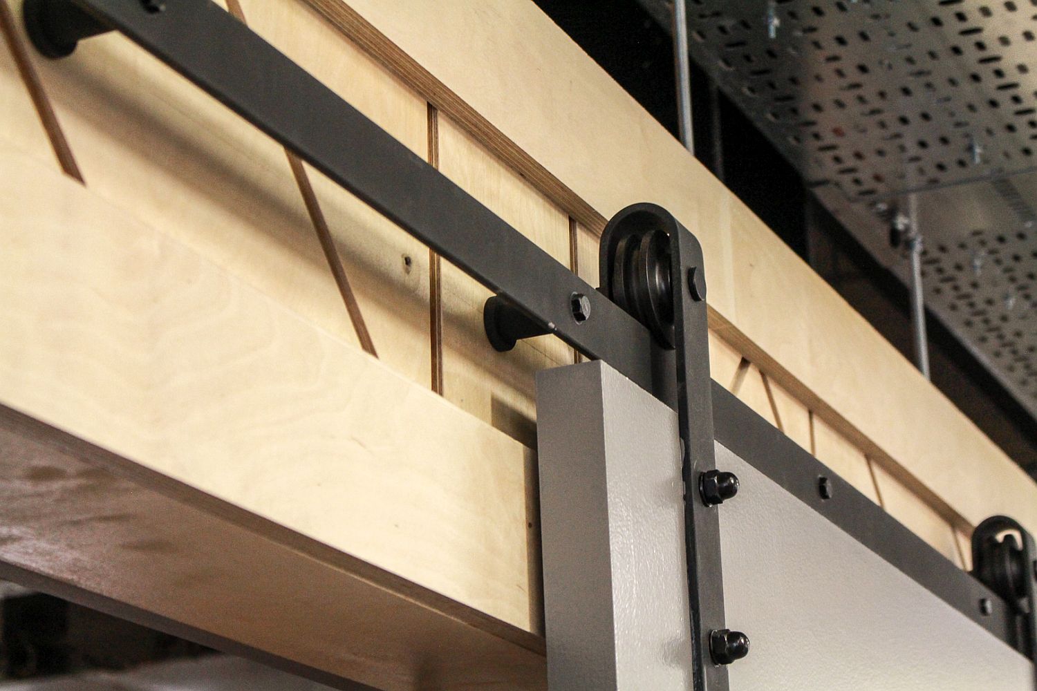 Barn style sliding doors make a comeback inside modern interiors