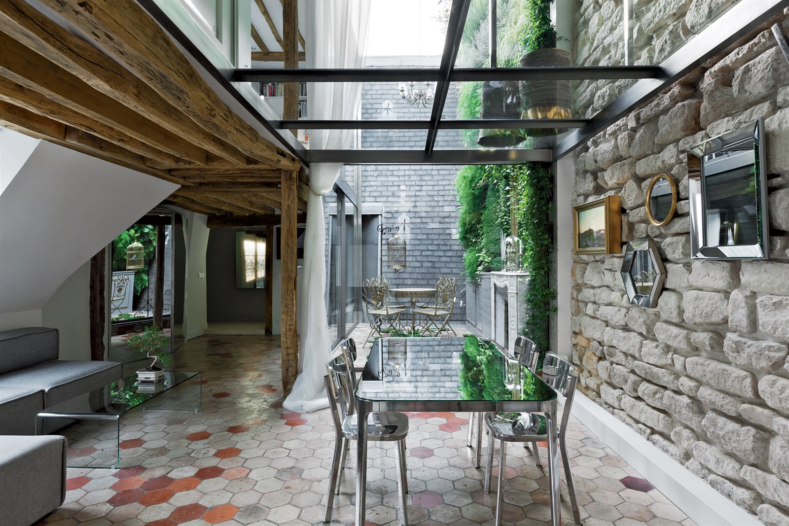 Glass floor of the top level with a beautiful dining room below