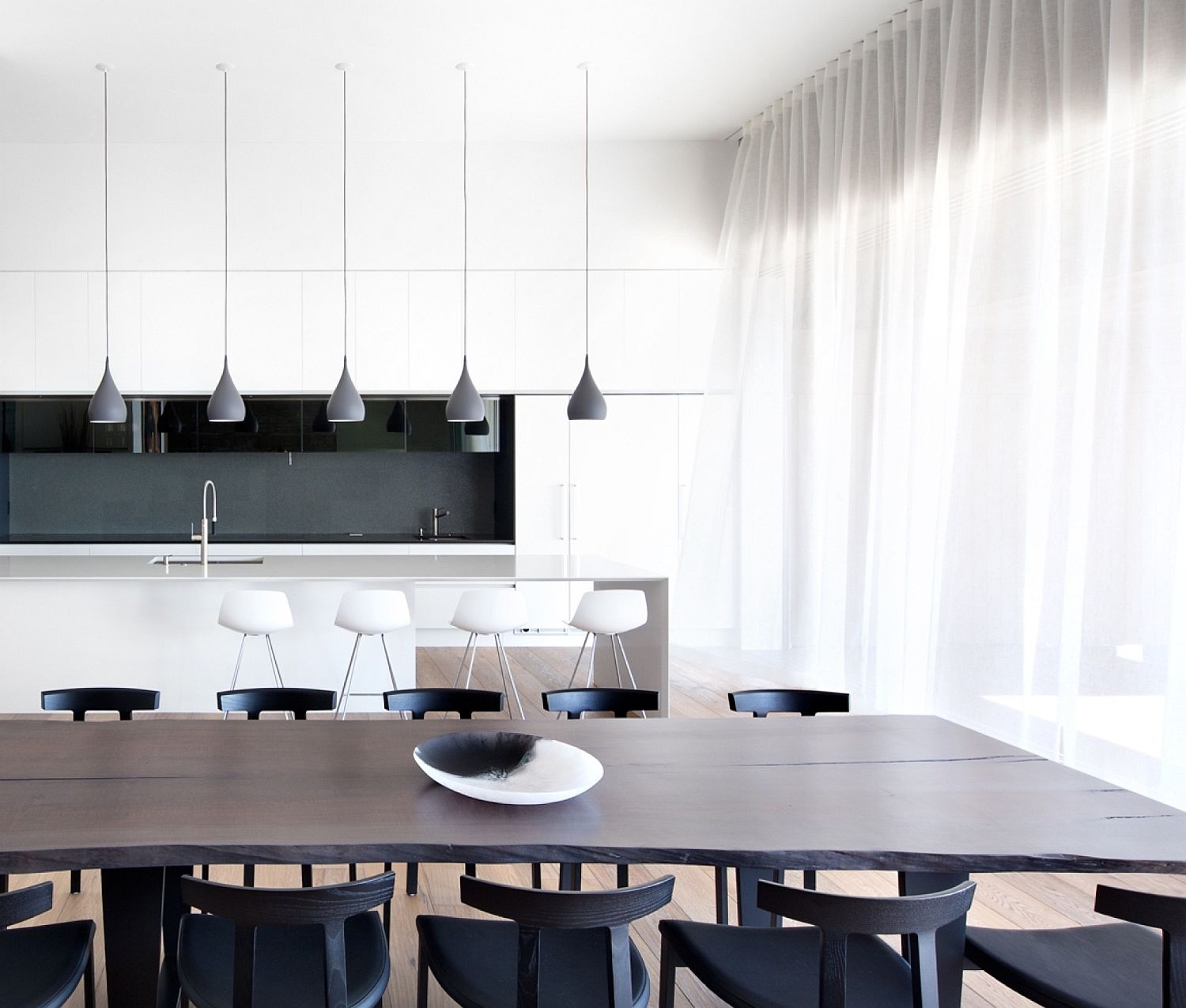 Minimal kitchen and dining room in white, black and gray