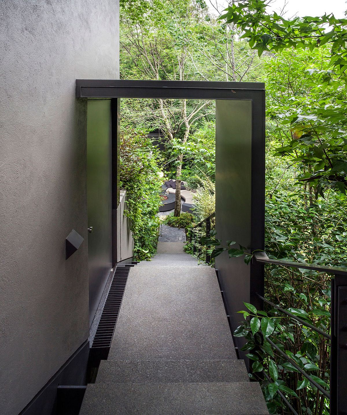 Staircase leading the house surrounded by greenery