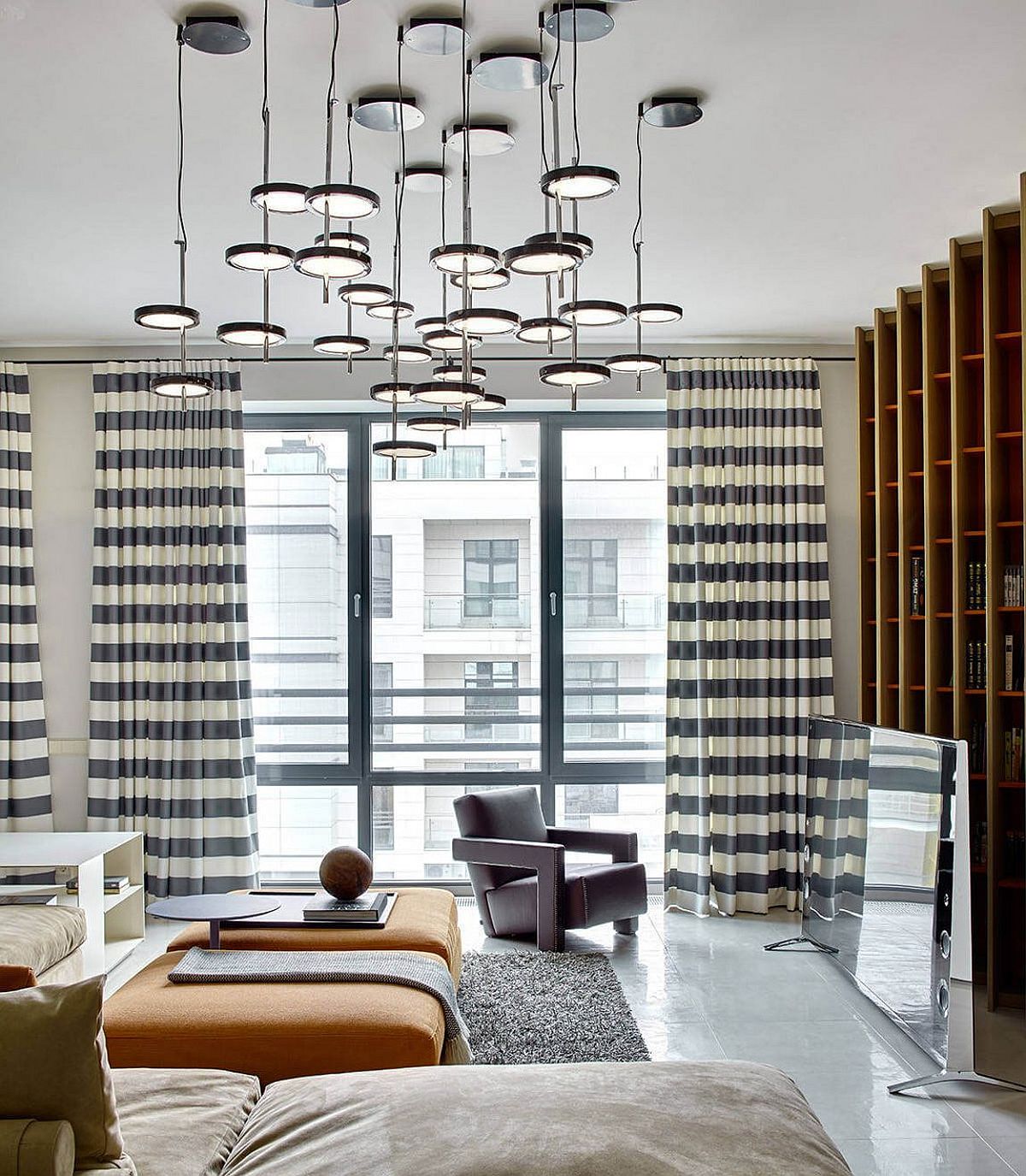 Unique lighting fixture and natural light inside the Russian apartment