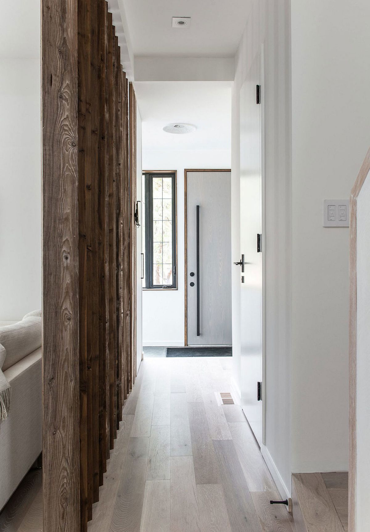 Wooden slats delineate space inside the home