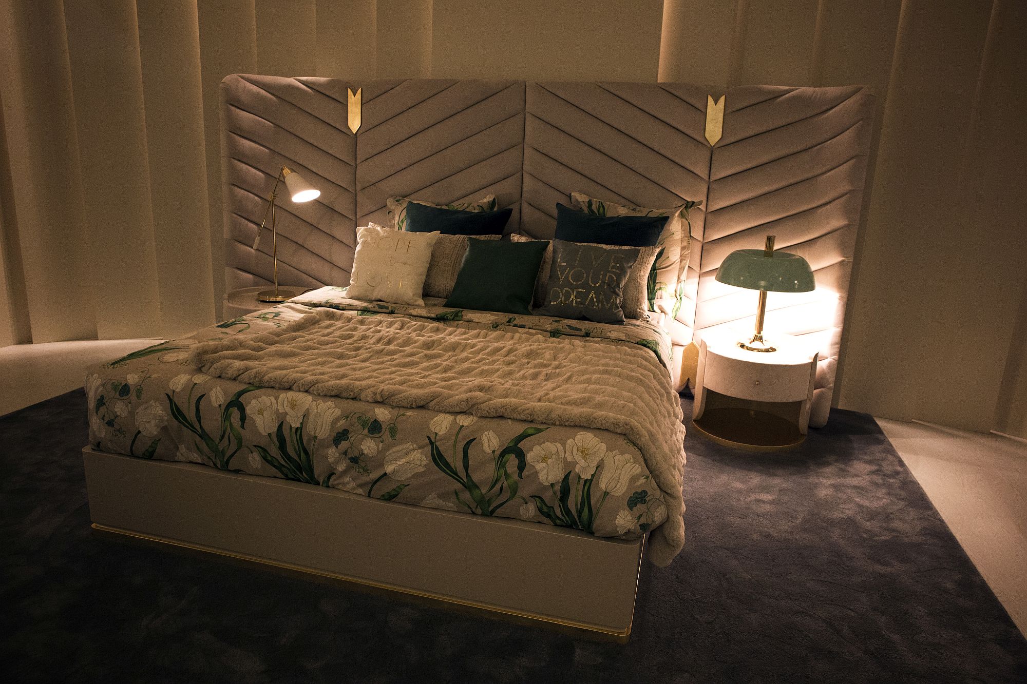 Combine contrasting bedside table lamps for a unique look