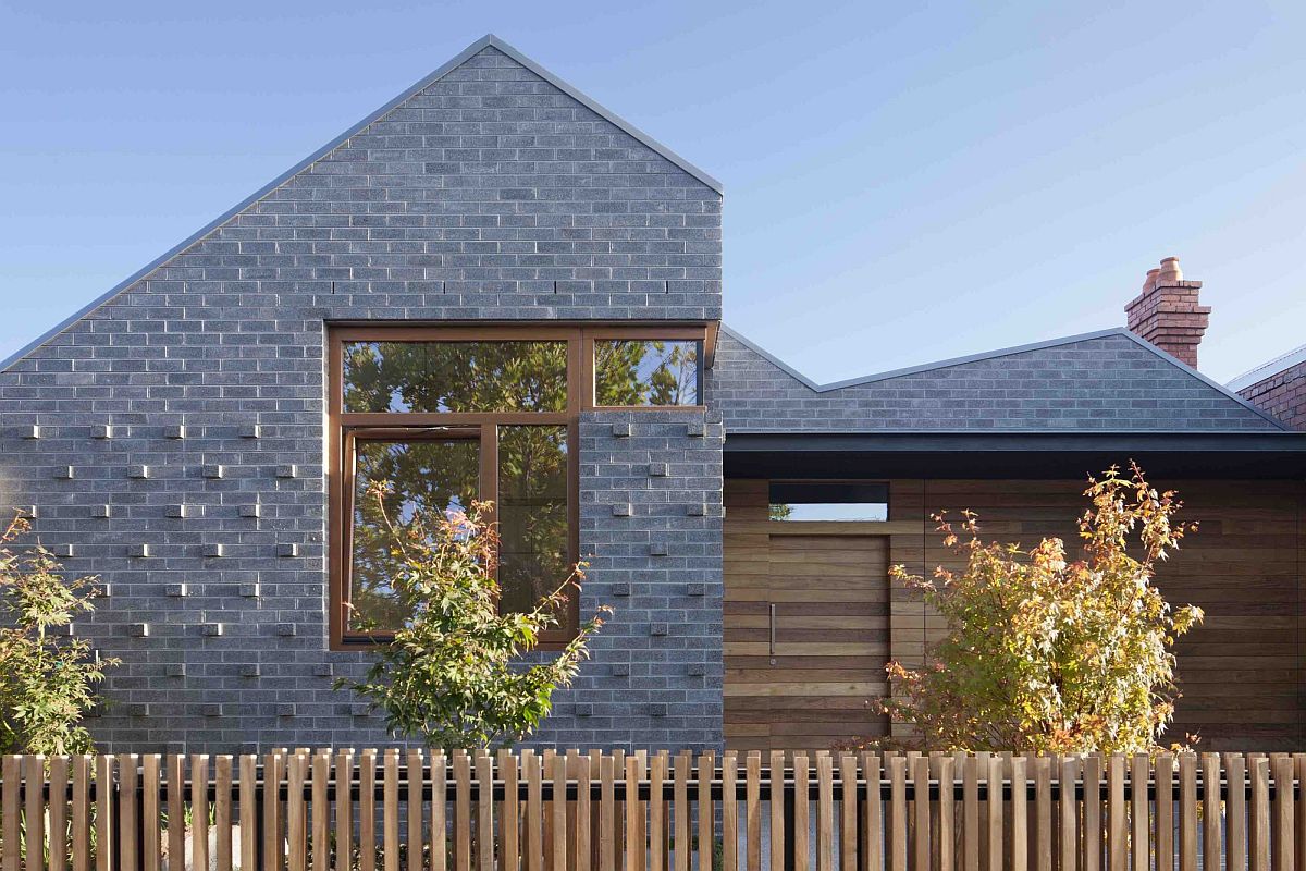 Gray tiles and wood give the house a unique exterior