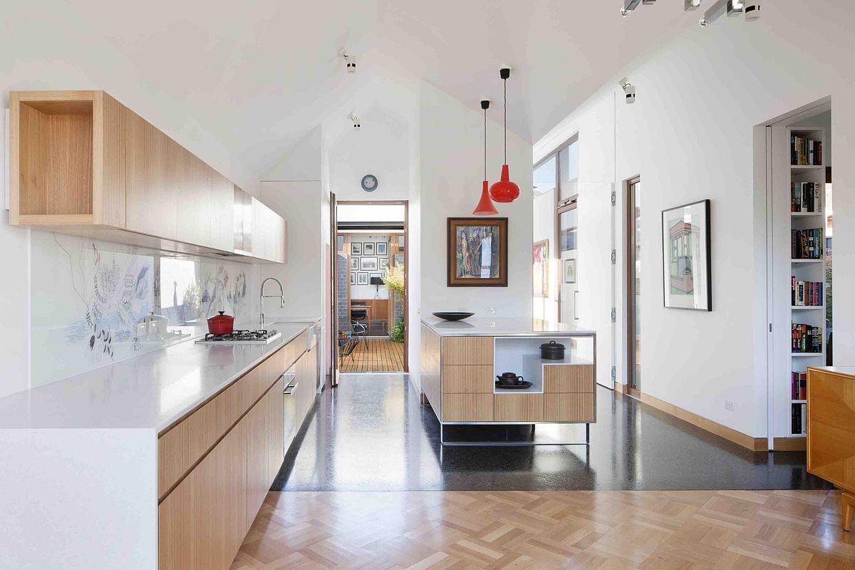 Large and open kitchen design with wooden shelves and corian countertops