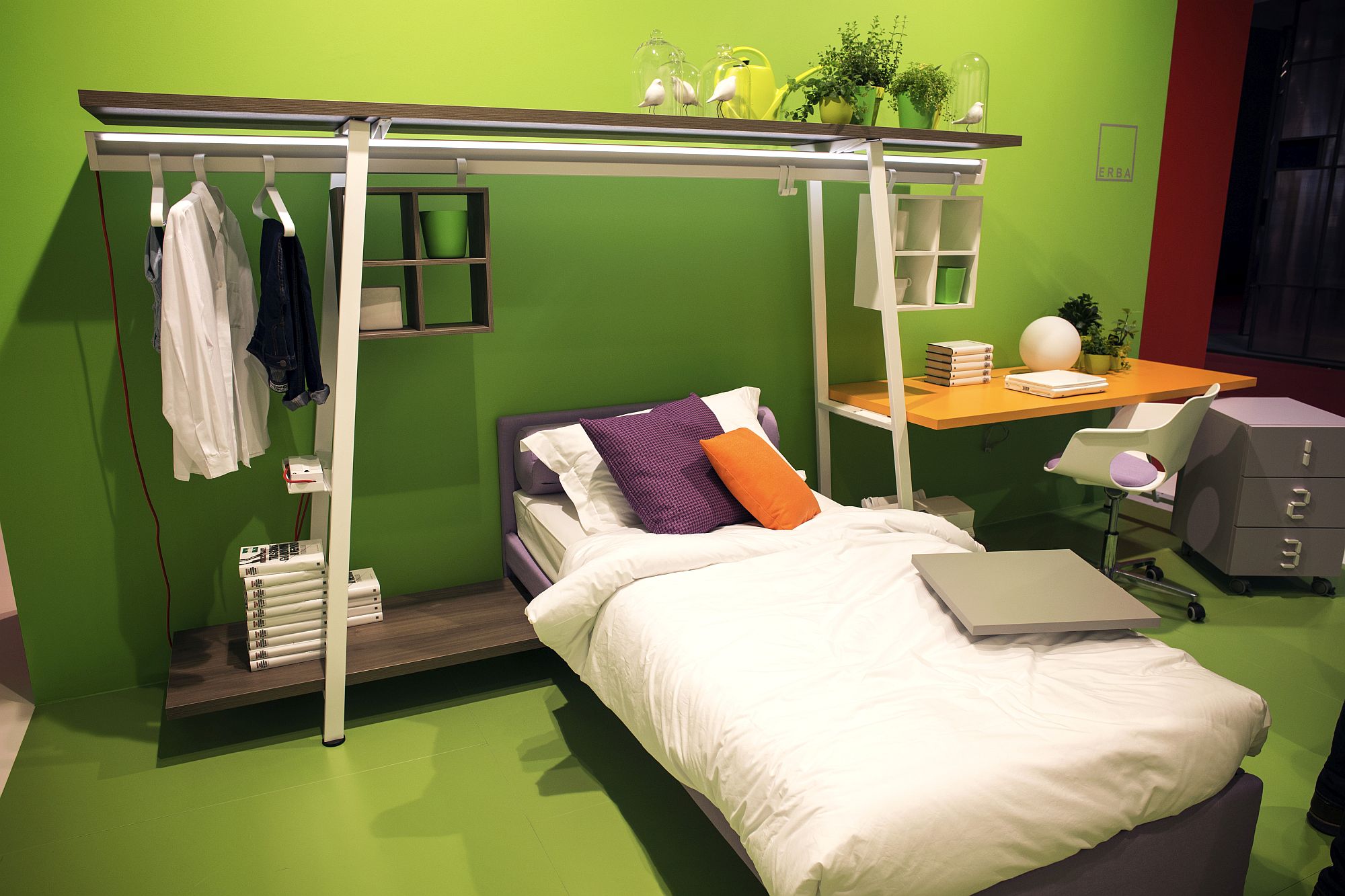 Modern minimal kids’ bedroom with stylish clothes hanger and small workstation